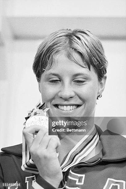 10/17/64 TOKYO OLYMPICS-DONNA DEVARONA WITH HER GOLD MEDAL AFTER THE 400M MEDLEY RACE.