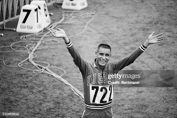 Happy Billy Mills, USA. Waving and smiling after winning the 10,000 meter race.