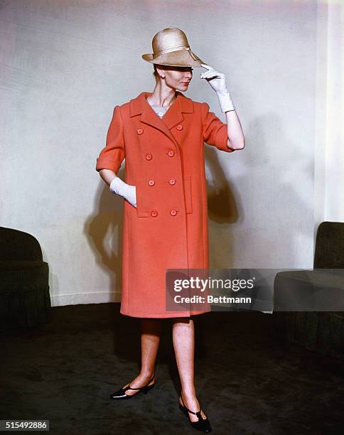 Pale silhouette...For Nina Ricci, young designer Gerard Pipart created this pale pink coat silhouette in his first Spring collection. Done in a...