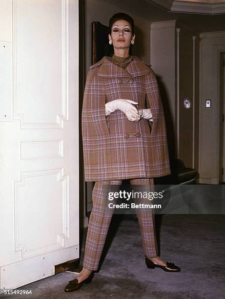 Travel caper...Labeled for "Travel Only" by Norman Norell, is this three-piece ensemble, one of the first costumes shown in his Fall 1963 collection...