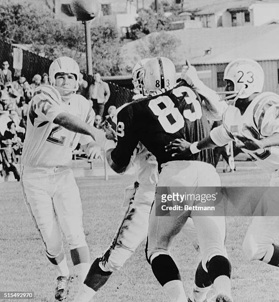 San Diego Chargers quarterback John Hadl throws a fifteen yard pass to Chargers running back Paul Lowe , who is coming in at right to pick off the...