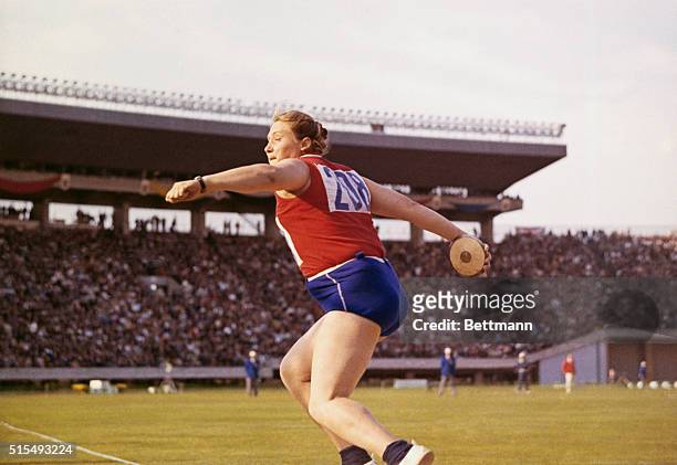 RUSSIAN WOMAN ATHLETE TAMARA PRESS USES ALL HER STRENGTH TO HURL THE DISCUS AT THE TOKYO OLYMPIC GAME 10/19. TAMARA WON THE EVENT, AND A GOLD MEDAL,...