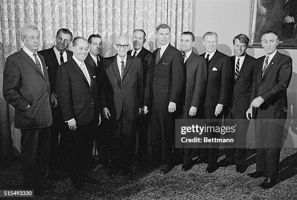 New members of the Senate pose with Senate leaders following the opening session of the 89th Congress today. Left to right are: Senators Everett...