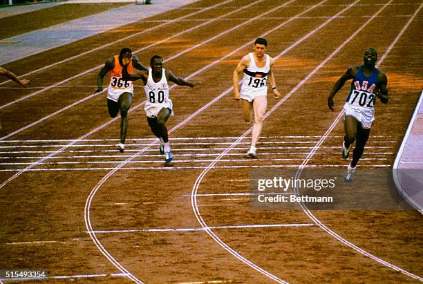 Final heat of the 100 meter run, won by Bob Hayes of the U.S. Photo shows runners about halfway down the track.