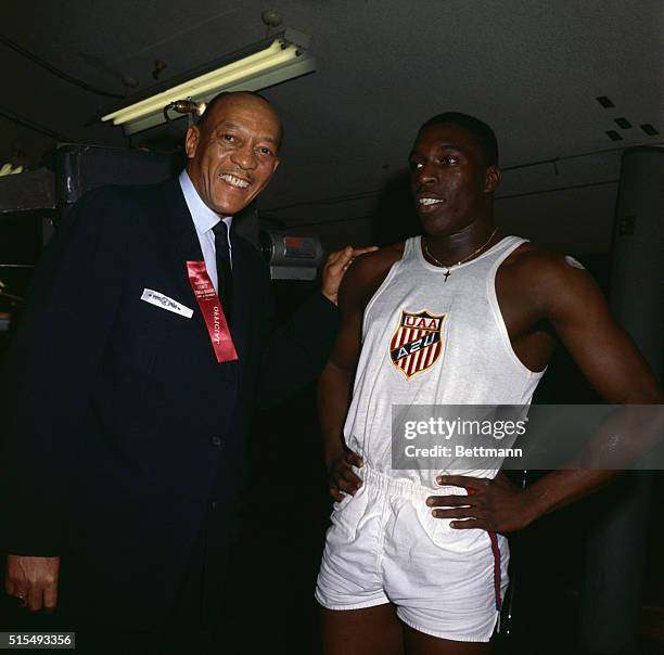 Bob Hayes, of Florida A&M, with Jesse Owens, Olympic champion, who held records for more than 20 years after he tied the world's record.