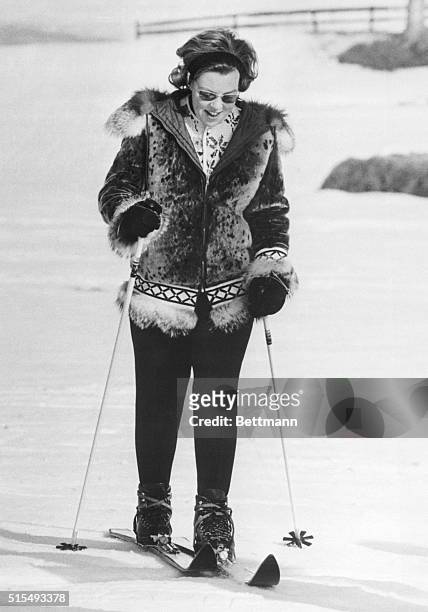 Winter Vacation. Gstaad, Switzerland: Warmly dressed in a fur jacket and heavy ski boots, Crown Princess Beatrix of the Netherlands looks down at her...