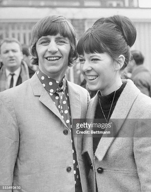 Hove, England: Happy Newlyweds. Ringo Starr, drummer with the Beatles, and his bride, Maureen Cox, are all smiles as they pose for photographers at...