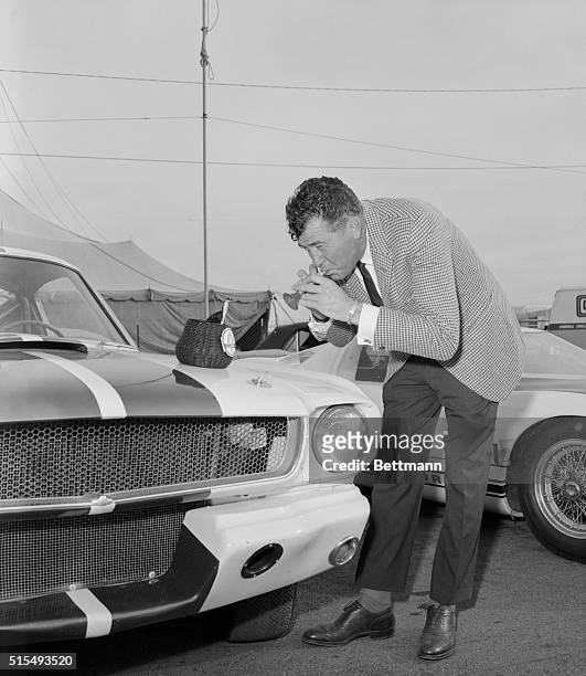 Riverside, California: Cobra sports car builder Carroll Shelby whose Ford powered cars have been a constant contender in International racing, plays...
