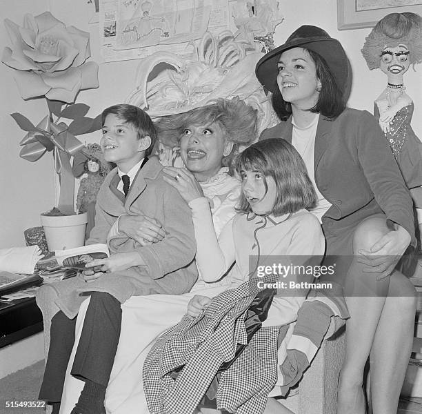 Garland Children Visit "Dolly" New York: Musical comedy star Carol Channing entertains the children of singer Judy Garland in her dressing room at...