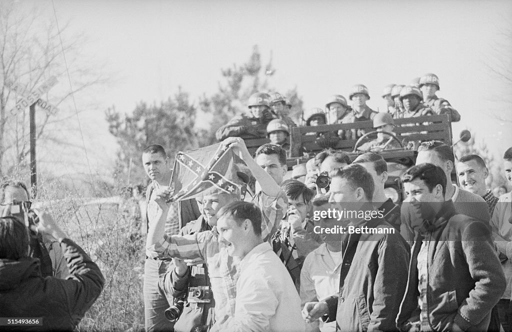 Youths Taunting Marchers with Confederate Flag