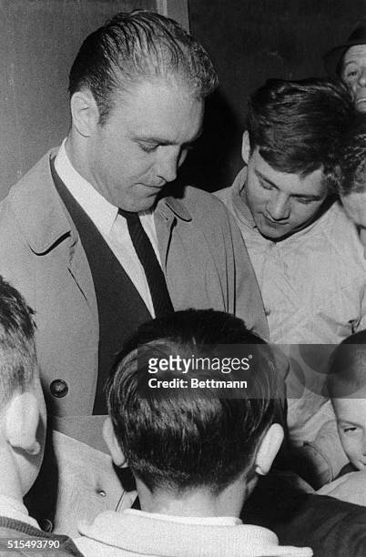 Chicago Black Hawks player Bobby Hull is surrounded by young autograph seekers after the Hawks lost the fifth game of the Stanley Cup finals to the...