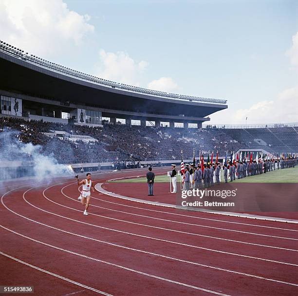 Tokyo, Japan, Olympic torch runner circles track during rehearsal.