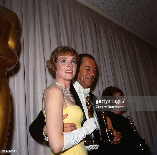 Three Oscar winners hold their awards after presentations at the 37th Annual Academy Awards. Left is English actress Julie Andrews, Best Actress;...