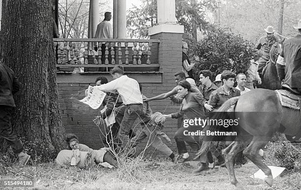 Montgomery, Alabama: Scramble For Cover. Civil rights demonstrators scramble for cover as mounted Sheriff's posse rides through them here March 16th....