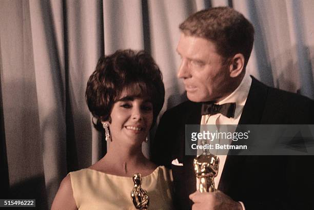 Annual Academy Awards Presentations: Burt Lancaster and Liz Taylor with their awards after taking Oscars for Best Actor and Actress.