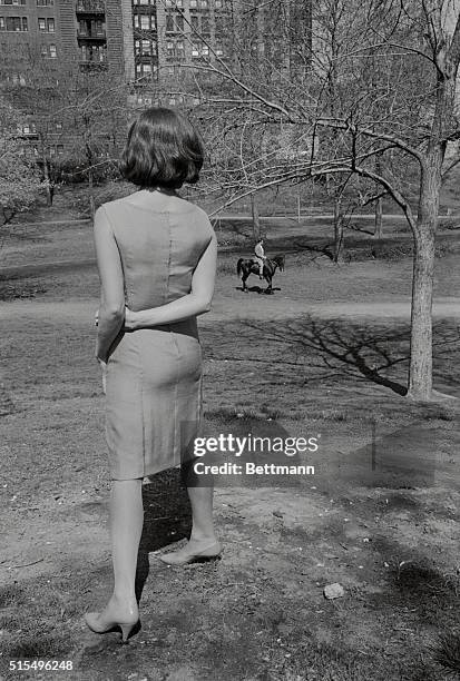 Lovely Claudia Cardinale spots Rock Hudson riding a horse in Central Park in this scene for the movie Blindfold. Location filming in the New York...