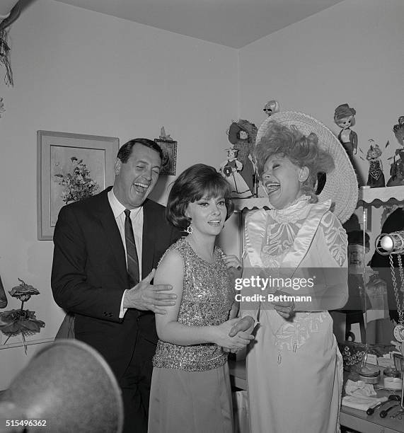 Carol Channing , starring in the hit musical, Hello Dolly, is delighted as she entertains movie stars, Gina Lollobrigid, and Rock Hudson, in her...