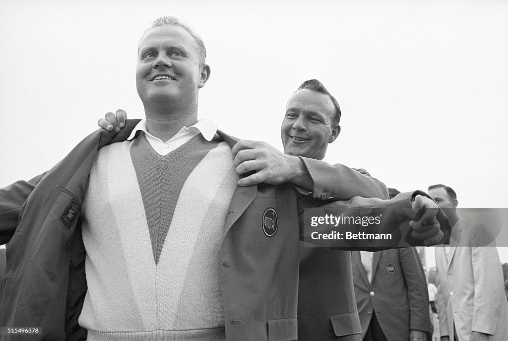 Arnold Palmer Helping Jack Nicklaus with Masters Jacket