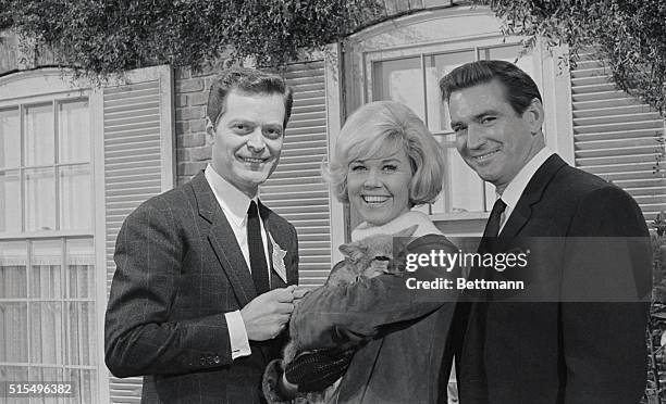 Segio Fantoni, Doris Day and Rod Taylor are shown on the set as they amuse themselves with a wolf between scenes of Do Not Disturb in which the trio...