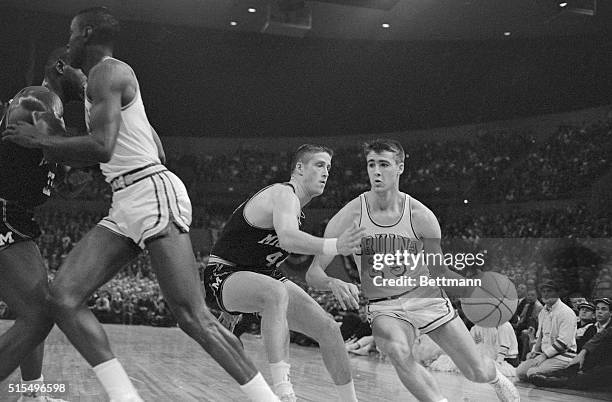 S Gail Goodrich drives in past Michigan's George Pomey in NCAA Championship game.
