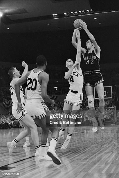 Princeton forward Bill Bradley rises above a defending Vernon Smith and fellow Wichita State defenders for a shot.