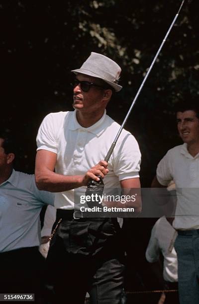 Harrison, N.Y. Juan "Chi-Chi" Rodriguez tees off, blast out of sand trap and putts on 5th hole during July 29th first round of play of Thunderbird...