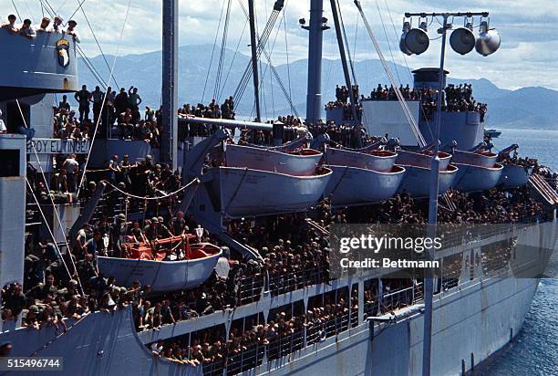 Arrival of troop ship USS General Leroy Eltringe July 29th at camp Ranh Bay with troops of 101st. Airborne Division crowded on decks.