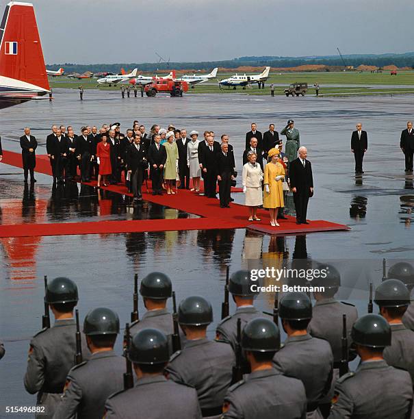 Queen Elizabeth and West German President Heinrich Luebke stand at attention at Wahn Airport during May 18th welcoming ceremonies for the Queen. The...