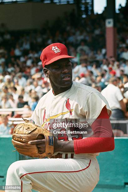 St. Louis Cardinal pitcher Bob Gibson warms up at Busch Stadium.