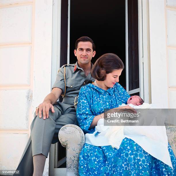 Corfu, Greece....King Constantine of Greece and Queen Anne-Marie look at their baby girl July 14. The girl, born July 10, weighed nine pounds, nine...