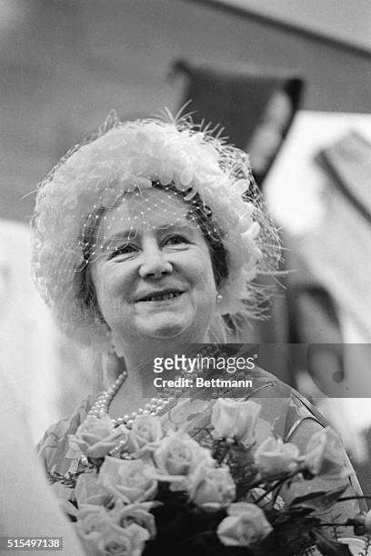 Smiling Queen Elizabeth, the Queen Mother, as she toured the Red Cross center here 6/24 on the second of her five-day visit to Toronto.