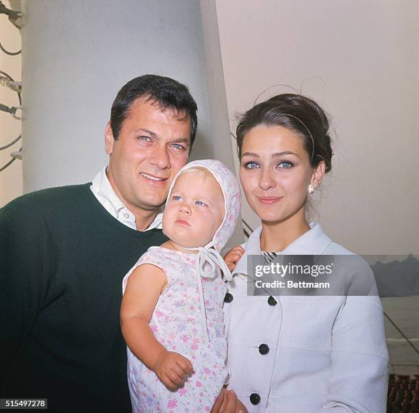 New York. Actor Tony Curtis, his actress wife Christine Kaufmann and their one year old girl Alexandra leave New York aboard the France August 5. The...