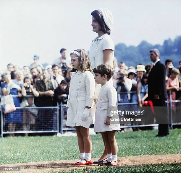 Runnymede, England: Mrs. John F. Kennedy stands with her children at the May 14 dedication ceremonies of a memorial to her late husband.