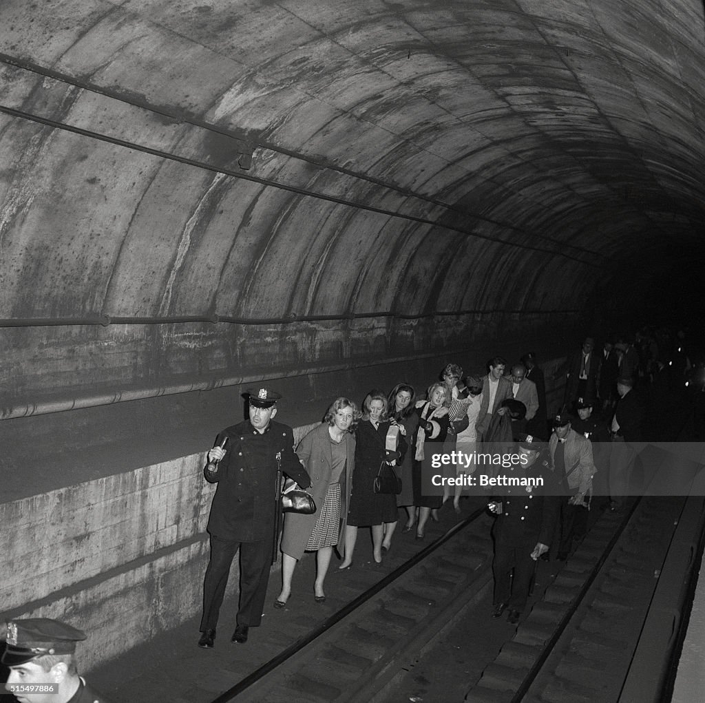 Policemen Leading Subway Passengers to Safety