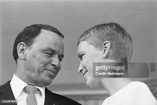 Mr. And Mrs. Frank Sinatra exchange fond glances following their wedding on July 19 at the Sands Hotel in Las Vegas.