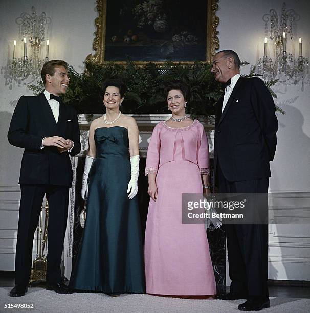 President Lyndon Johnson , Princess Margaret, Mrs. Johnson, and Lord Snowdon pose for photographers in the Queen's room at the White House November...