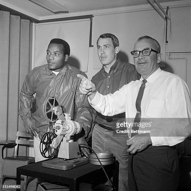 Cleveland Browns head coach Blanton Collier seems well pleased as he views victory over the Dallas Cowboys with fullback Jim Brown and quarterback...