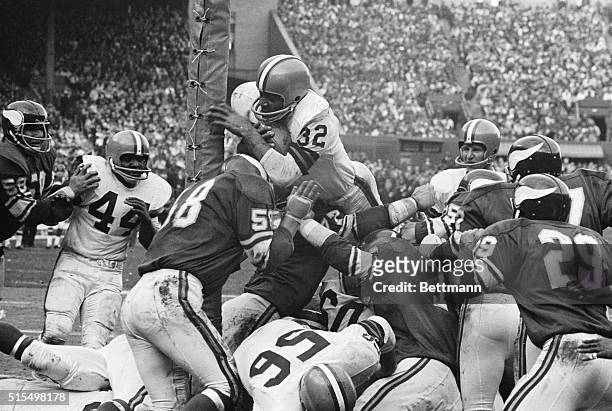 Cleveland Browns fullback Jim Brown scores a touchdown in the fourth quarter of the game against the Minnesota Vikings. The Vikings won the game by a...