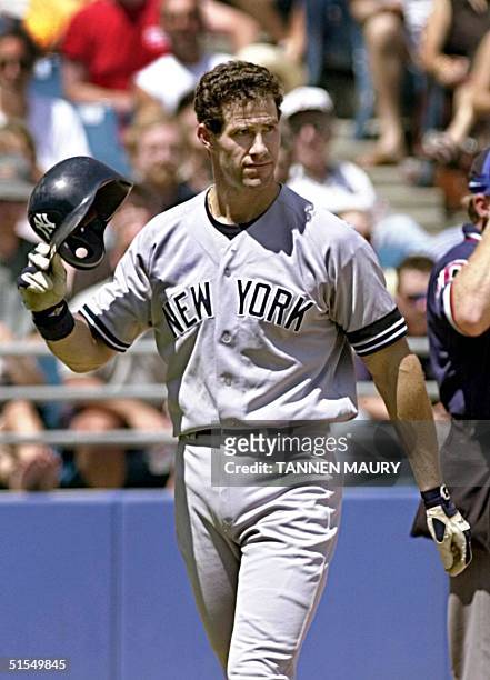 New York Yankees outfielder Paul O'Neill flips his helmet off as he reacts to striking out in the fourth inning against the Chicago White Sox 25 June...