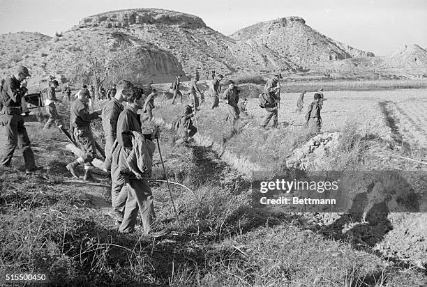 Airmen scour rugged countryside for a missing nuclear device, during fourth day of operation "Broken Arrow," here January 21st. The weapon was one of...