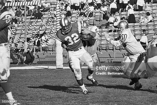 Cleveland Browns' Jimmy Brown was named Most Valuable Player of the Pro-Bowl game here 1/16. In this third quarter action, Brown carries the ball and...