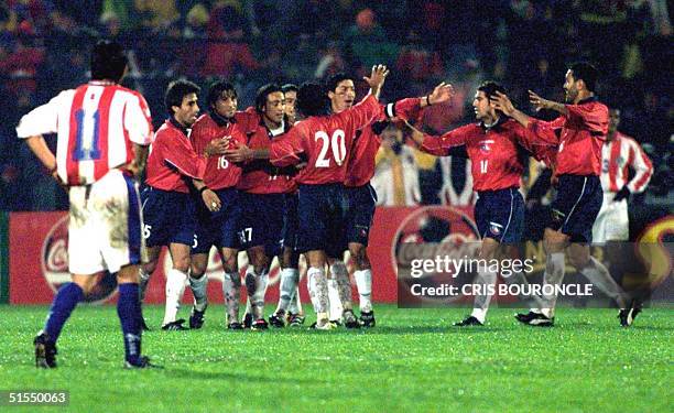 Members of the Chilean team celebrate the goal scored by Marcelo Salas against Paraguay during their 29 June, 2000 elimination match in Santiago....