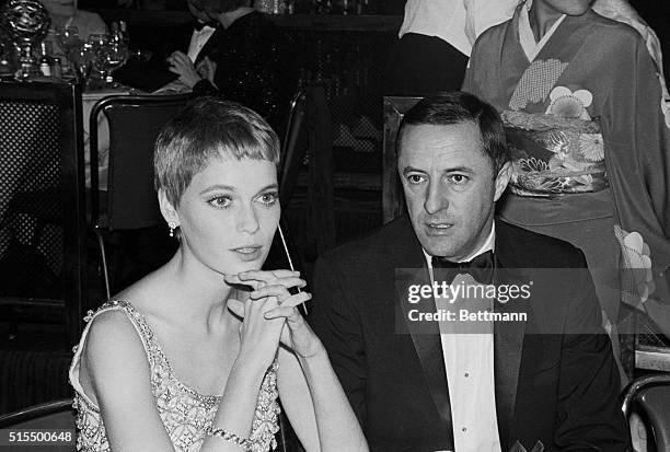 The "new" Mia Farrow watches closely as her colleagues receive their Golden Globe Awards of the Hollywood Foreign Press Association. Noted for her...