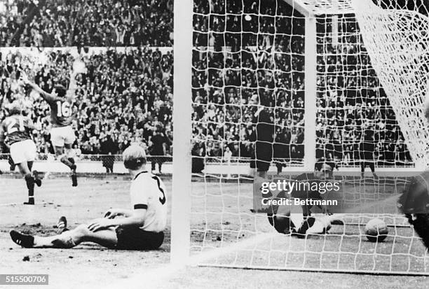 England Wins Championship. Wembley, England: West German goalkeeper Hans Tilkowski looks at ball in net after Martin Peters of England scored his...