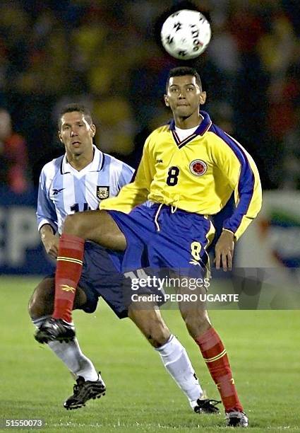 Frank Oviedo of Colombia kicks the ball in front of Diego Simeone of Argentina, during their 29 June, 2000 elimination match in Bogota. Frank Oviedo...