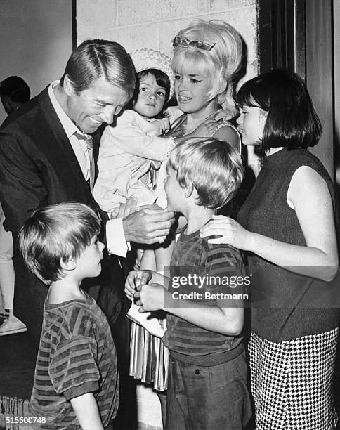 Actor Mickey Hargitay is obviously enjoying his reunion with his former wife, actress Jayne Mansfield, and their children July 19th, backstage at the...