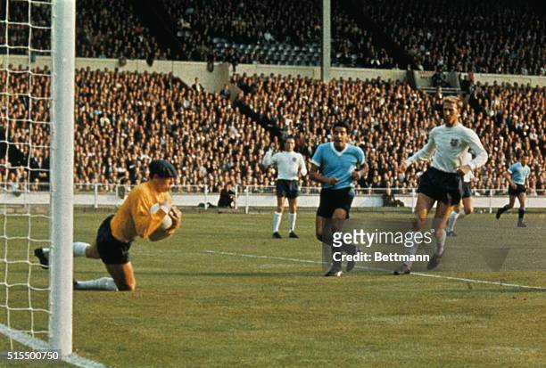 During the first game of the World Cup Soccer Championships at Wembley Stadium, July 11th, English goalie Gordon Banks falls to his knees in effort...