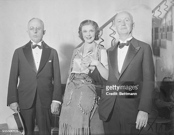 Actress Ginger Rogers at the Alvin Theatre with Kansas City mayor Bryce B. Smith and St. Louis mayor Victor J. Miller. A friendly controversy is...