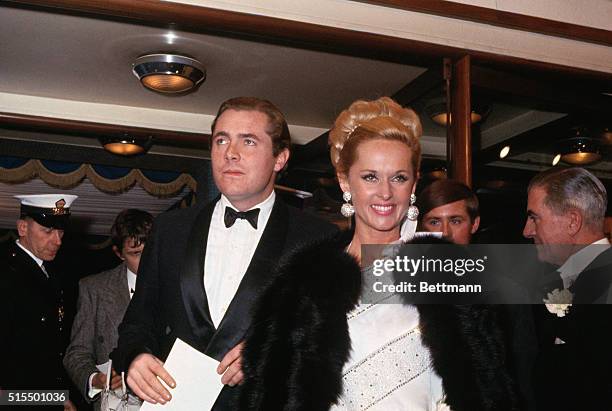 Tippi Hedren, actress is shown with an unidentified man at premiere of film, The Countess From Hong Kong.