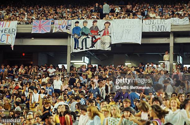 This is a general view of fans attending a Beatles concert, at Shea Stadium, circa 1965.